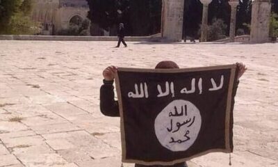 A youngster waiting Isis flag in Jerusalem. Credit: ‘Stand With Israel’ FB page.