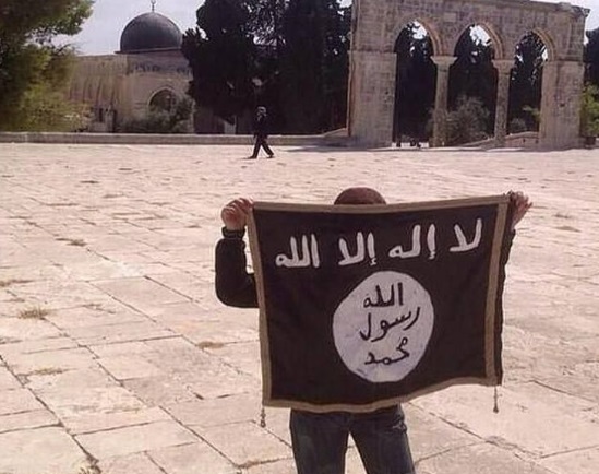 A youngster waiting Isis flag in Jerusalem. Credit: ‘Stand With Israel’ FB page.